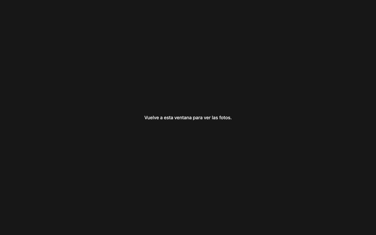 Pantalla oscura con el mensaje Vuelve a esta ventana para ver las fotos